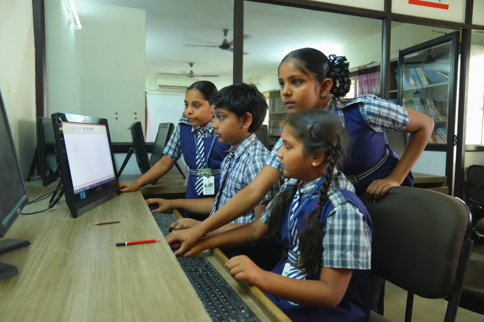 School students participating in hands-on science learning inside a classroom lab