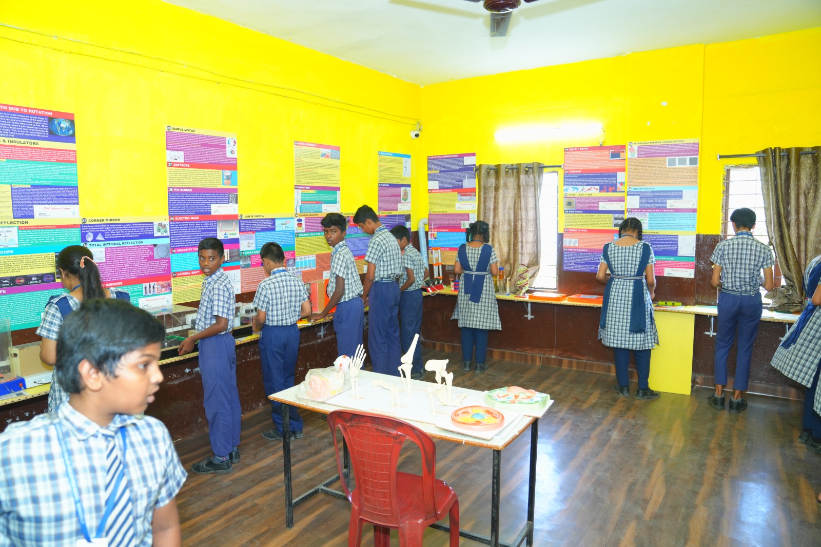 School children learning computer skills in a classroom computer lab